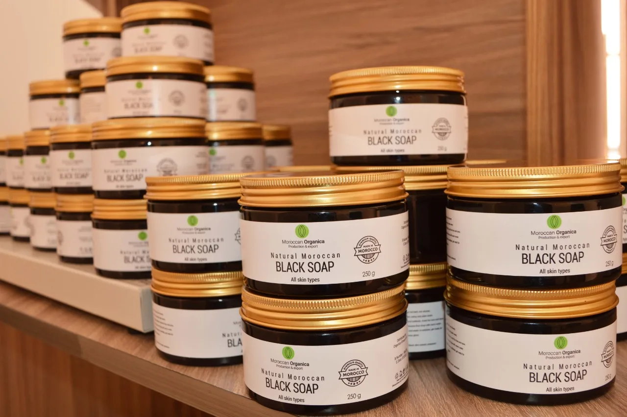 Moroccan beauty products being labeled and packed at our Agadir workshop